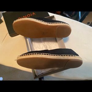 Black Vionic slip-ons